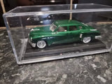 Green 1948 Tucker Torpedo 1:43 diecast car in clear display case
