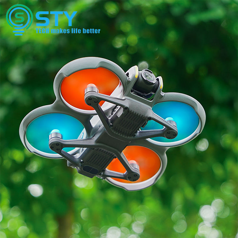 Drone propeller blades set with gray frames and orange/blue guards