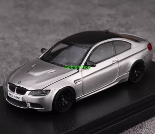 Silver sports coupe diecast model car with black wheels, front 3/4 view