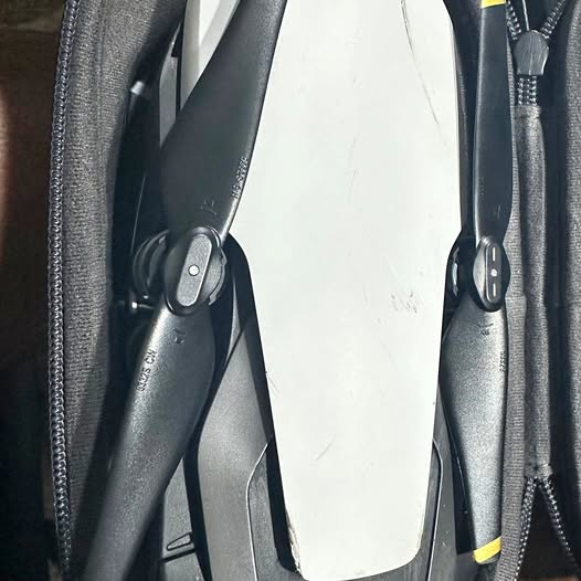 DJI Mavic Air drone arms with folded propellers in dark gray