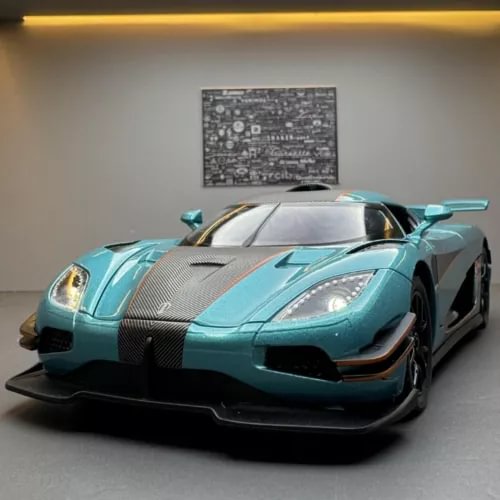 Turquoise diecast sports car model with black accents, front 3/4 view, 1:24 scale toy