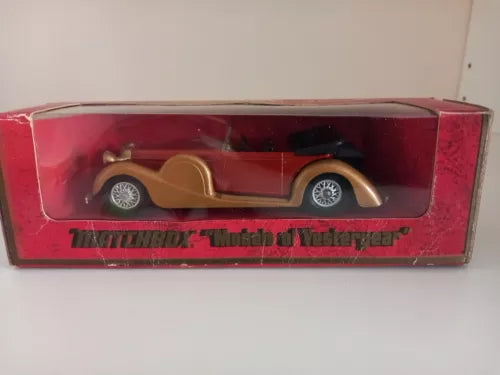 Matchbox Yesteryear diecast model car in red display box, brown coupe with chrome wheels.