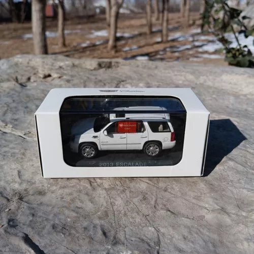 Cadillac Escalade diecast SUV toy, white, in display box