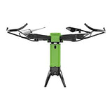 Green quadcopter drone with black landing legs and four propellers