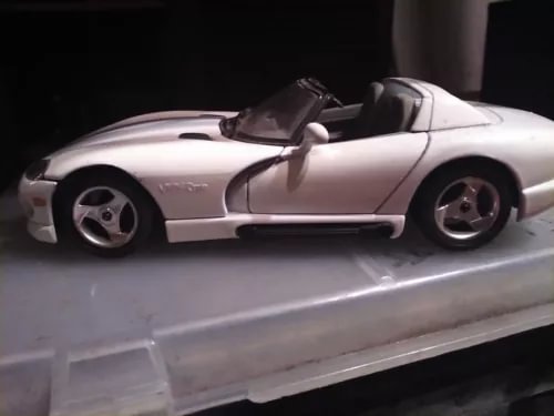 White 1/24 scale convertible diecast metal car, side view with open top