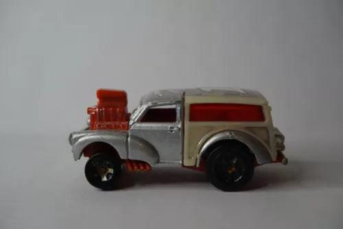 Gray diecast toy car with red roof, silver details, side doors, and black wheels