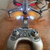 Drone remote controller with two joysticks and central buttons