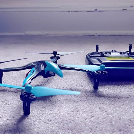 Blue quadcopter drone with four propellers