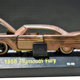 Diecast car model, bronze 1958 Plymouth Fury, side view on display base