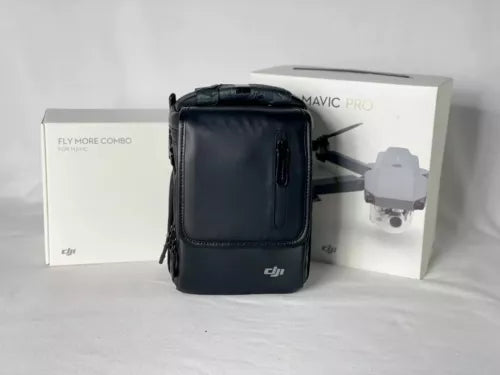 Black drone carrying case with zipper, beside Fly More Combo boxes