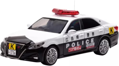 Diecast toy police car model, white and black with detailed grille and wheels