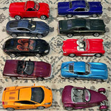 10 diecast cars display with red, blue, green, black, and purple models