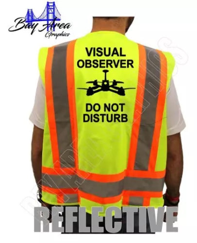 Neon yellow high-vis safety vest with orange reflective bands, back drone icon and text
