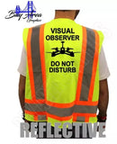 Neon yellow high-vis safety vest with orange reflective bands, back drone icon and text