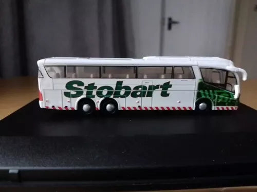 Diecast Stobart coach bus model, white with green detailing and clear windows