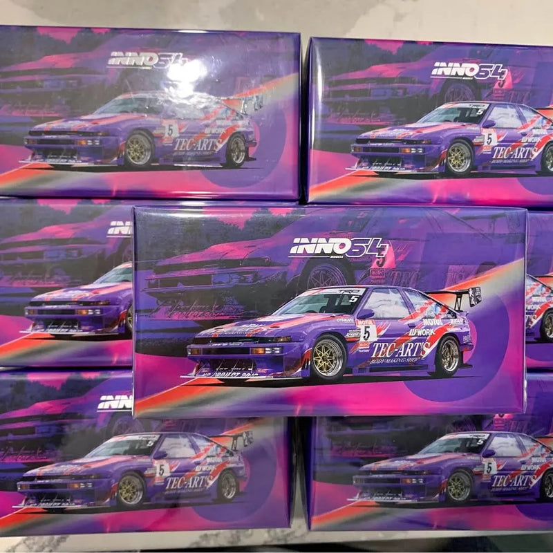 1:64 diecast model car in purple graphic box with racing-style AE86 design