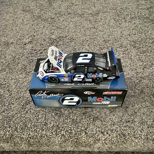 1:24 scale diecast race car, black with blue accents and #2 Rusty Wallace branding