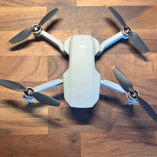DJI Mini 2 quadcopter drone with four propeller arms, white body
