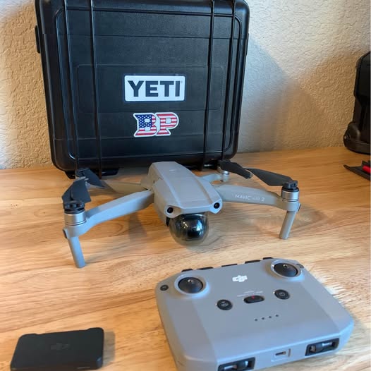 Grey DJI drone with controller and accessories in protective hard case