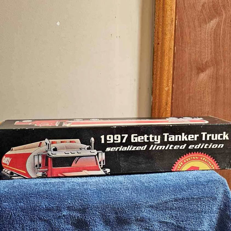 Red diecast tanker truck model with cab details and 1997 Getty text
