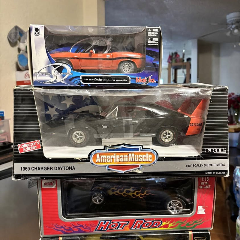 Diecast collectible cars, 3 boxed models with visible car fronts and logos
