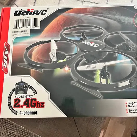UDI RC 2.4GHz quadcopter drone box with four rotors and controller graphic