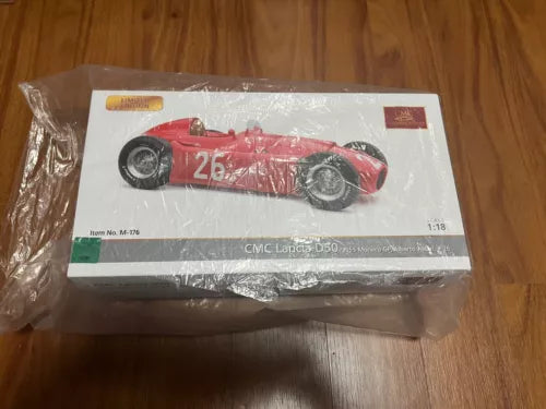 Red CMC Lancia D50 race car diecast model in retail box, 1:18 scale