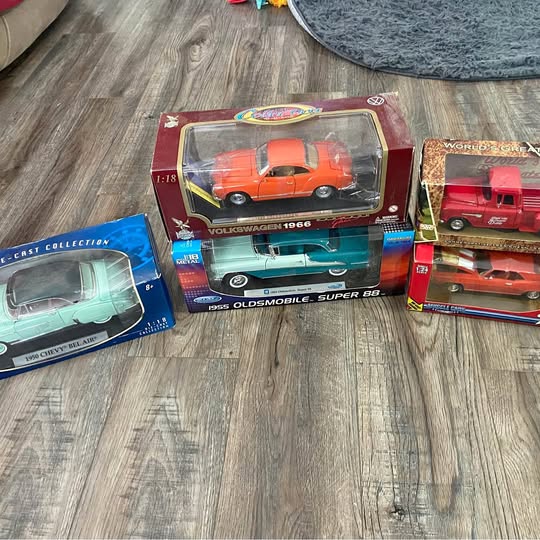 Diecast car set in display boxes with clear windows, orange, red, and teal cars