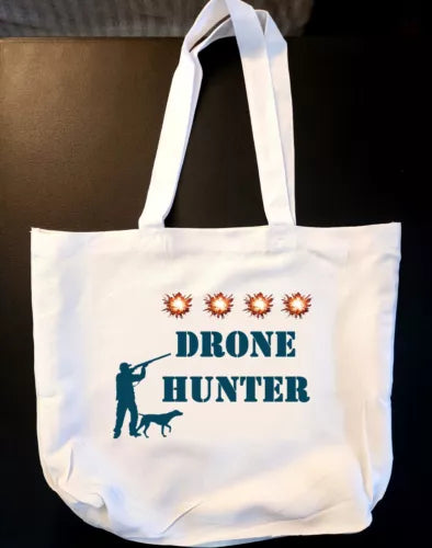 White reusable tote bag with DRONE HUNTER text and dog silhouette graphic