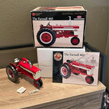 Red metal farm tractor model with box