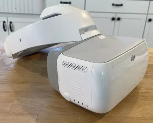 DJI Goggles FPV headset with white visor and front speaker grille