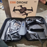 Foldable FPV quadcopter drone with remote controller in hard travel case