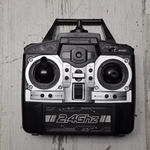Remote R/C drone controller with dual joysticks and 2.4GHz display panel