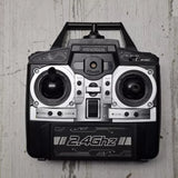 Remote R/C drone controller with dual joysticks and 2.4GHz display panel
