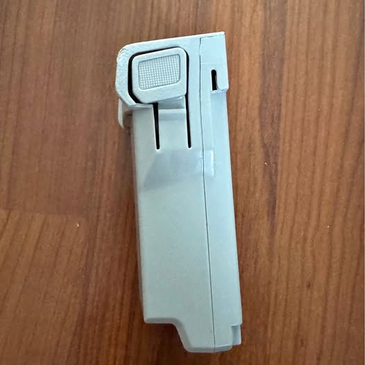 Drone battery pack with charging contacts, light gray