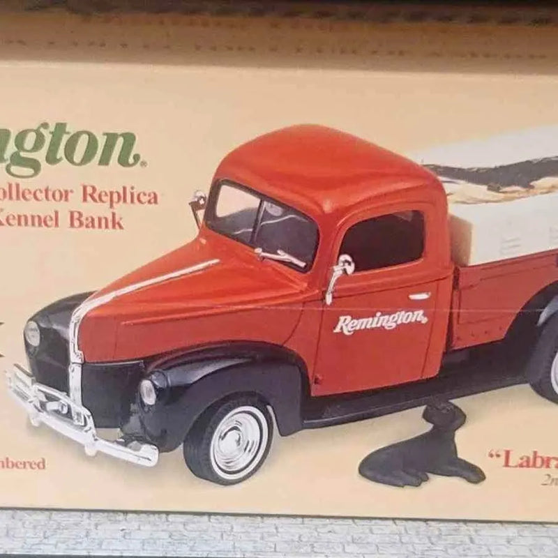 Red diecast pickup truck with Remington decal, whitewall-style tires, 1:24