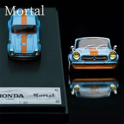 1:64 silver blue diecast model car with orange and white racing stripes, front view