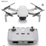 Compact DJI drone with foldable propellers and white transmitter controller