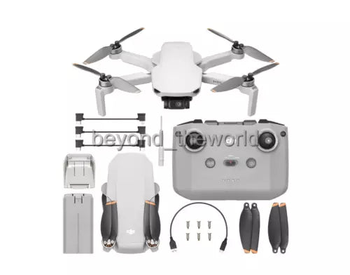 White camera drone with gray remote controller, propellers and spare parts bundle