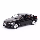 1:36 scale black BMW M550i xDrive diecast model car, front 3/4 view