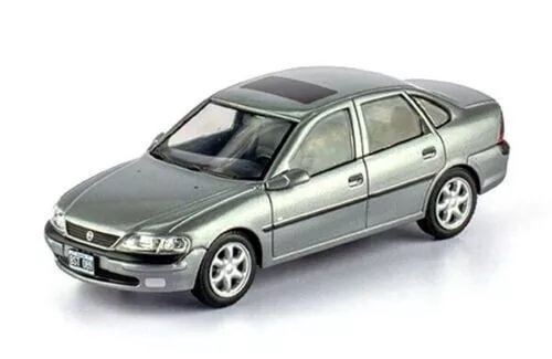 Diecast sedan car model in silver-gray, front three-quarter view