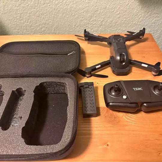 TSRC drone with black carrying case, controller, and spare battery