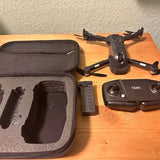 TSRC drone with black carrying case, controller, and spare battery