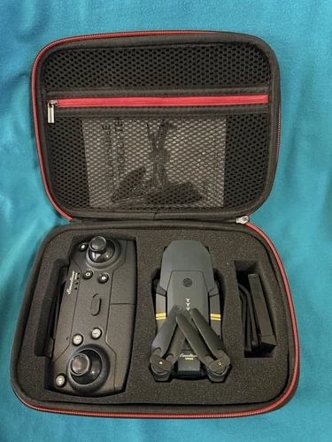 Foldable sub-250g drone in zippered hard case with controller and accessories
