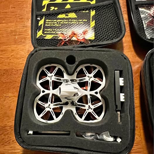 FPV whoop drone kit in hard case with white propellers