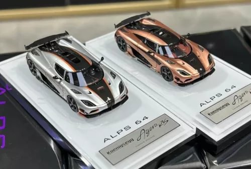 1:64 racing diecast resin cars, silver and copper-orange models on display