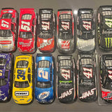 Loose 1/24 NASCAR diecast race cars, multiple styles in red, black, blue, and yellow