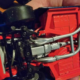 1:24 scale diecast vehicle engine and chassis parts, red body with black and silver details