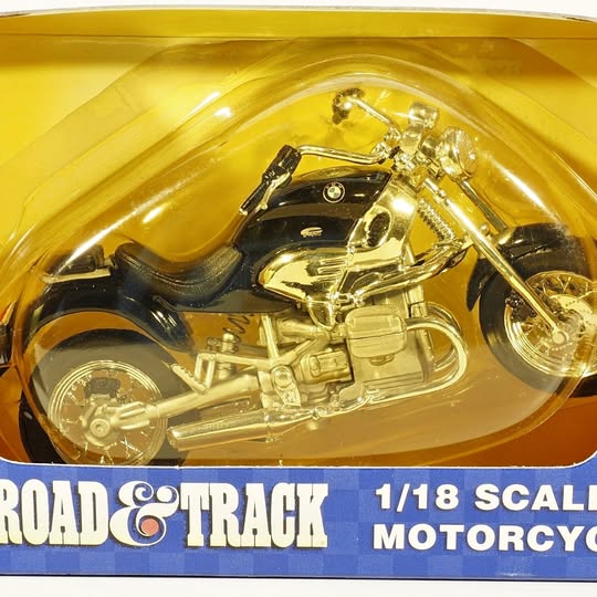1/18 scale diecast motorcycle, gold and black, in clear blister packaging