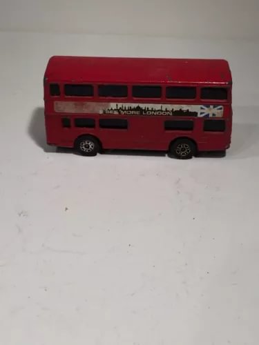 Red diecast double-decker London bus with black window panels, side view